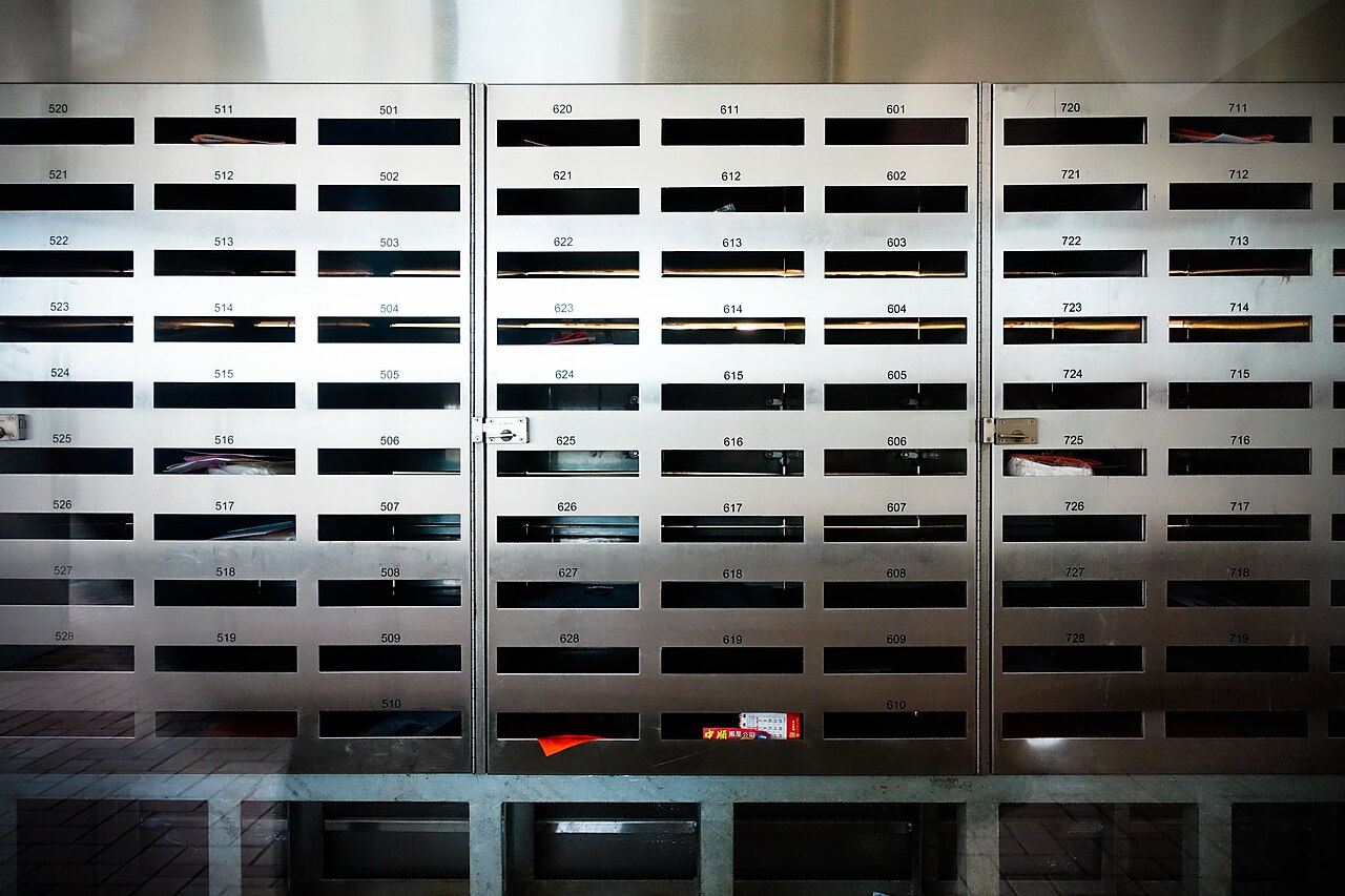 Bank of apartment mailboxes in a building lobby — illustrative of multi-family rental setup where bills-paid clauses commonly apply.